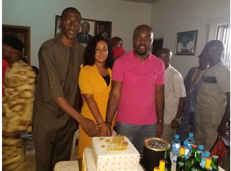 Hon. Oseme in red cutting his birthday cake | Hon. Oseme Celebrates Birthday To Promote Love