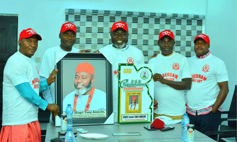 Chief Tony Amechi centre with his vising friends in a group photograph in his office